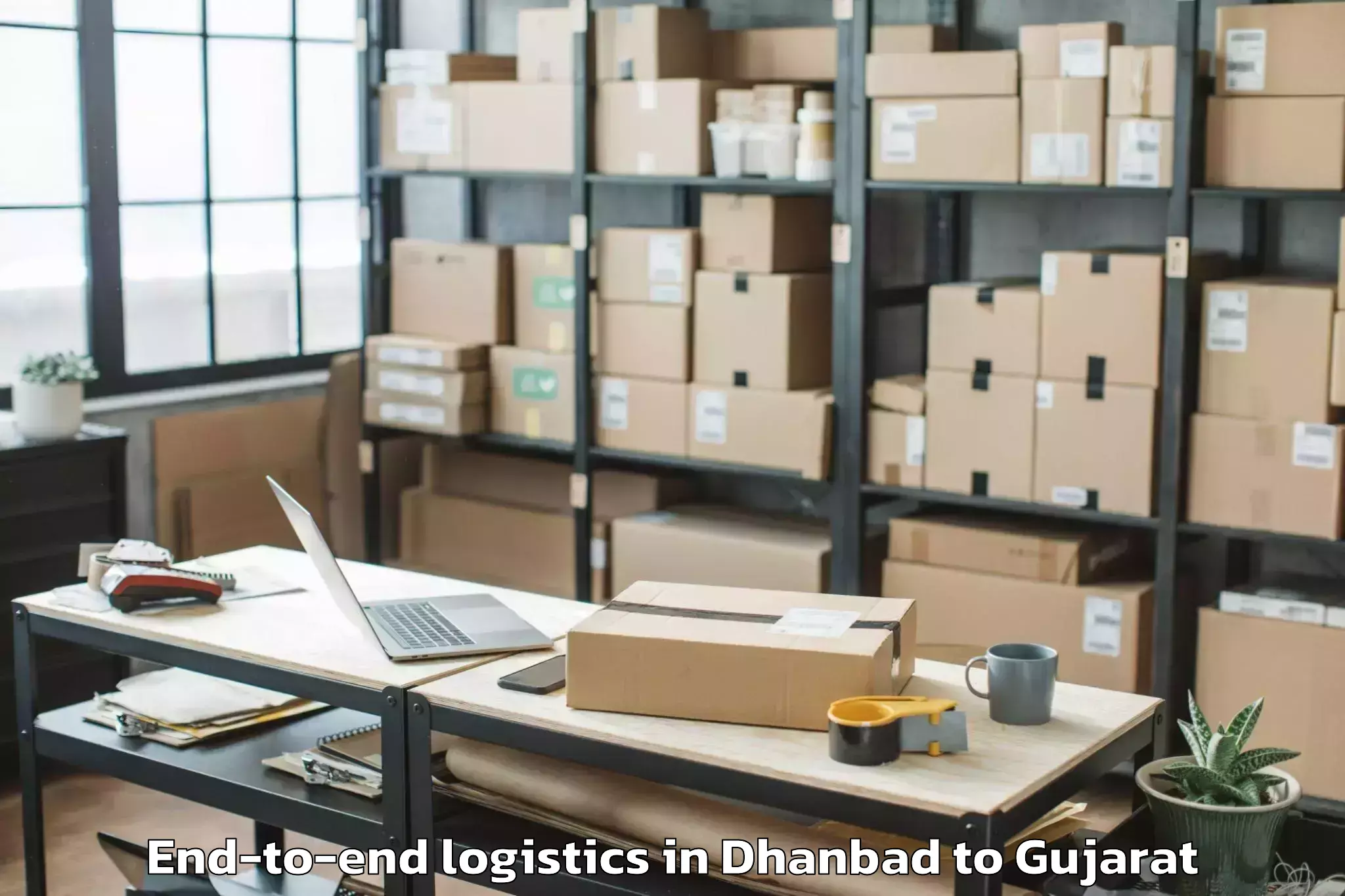 Trusted Dhanbad to Bhilad End To End Logistics